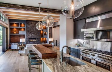 Modern custom home kitchen built by Sineath Construction - kitchen / living room view