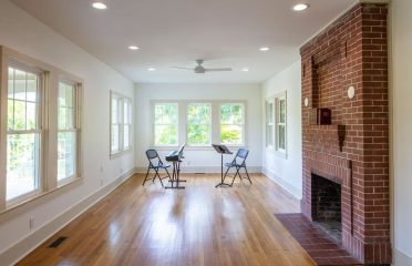 White room with wood floors
